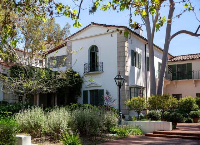 exterior view of scripp's browning building, a white, Spanish-style structure.