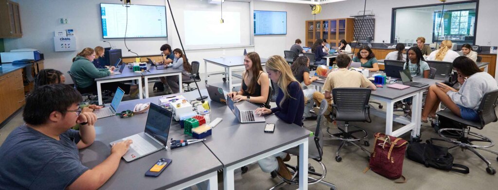 a lab filled with biology students sitting at desks