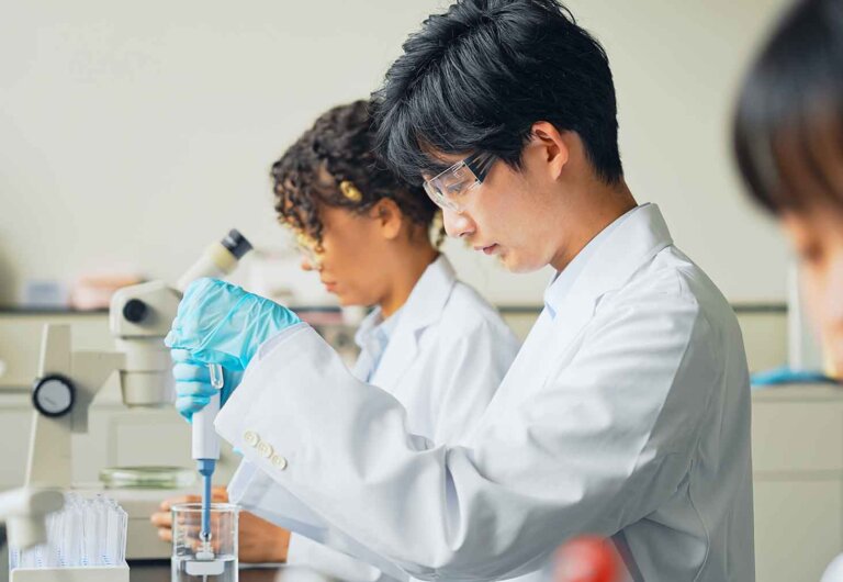 two students works in a pharmacy lab