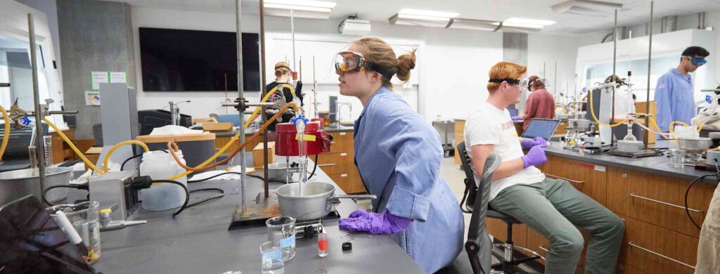 students perform experiments in a lab