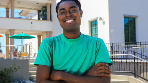 richard ampah stands outside of the nucleus west building.
